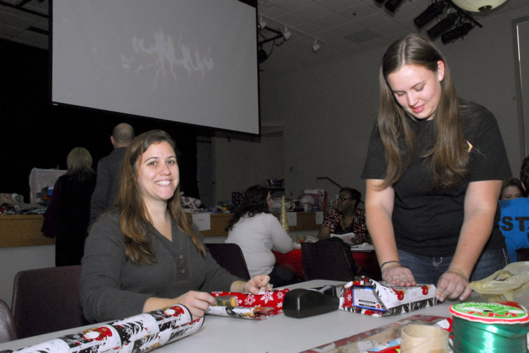 College of Southern Maryland nursing students, left to right, Kattie Woomer of Lusby and Melissa Moy of Waldorf help wrap Christmas gifts at the college’s Leonardtown Campus on Dec. 7.